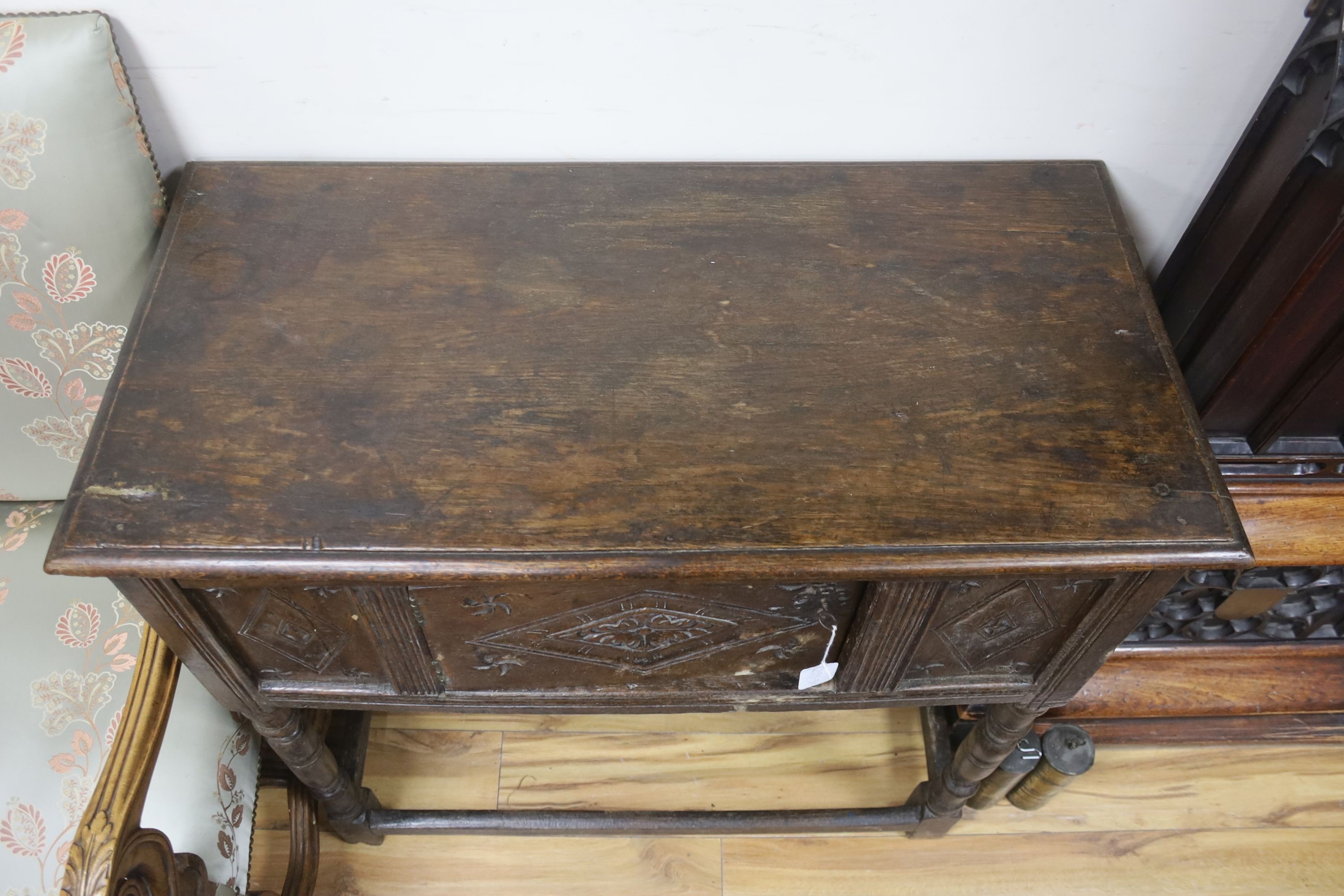 A 17th century panelled oak side cupboard, length 97cm, depth 48cm, height 91cm